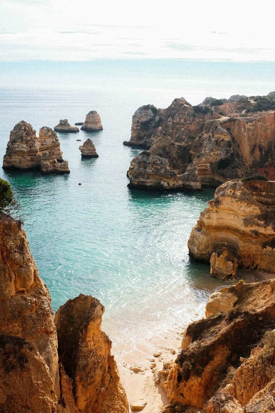 Golden sea stacks and cliffs on the Algarve coast at Lagos