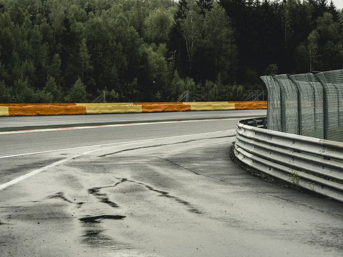 Wet kerbing and safety barriers at an empty race circuit